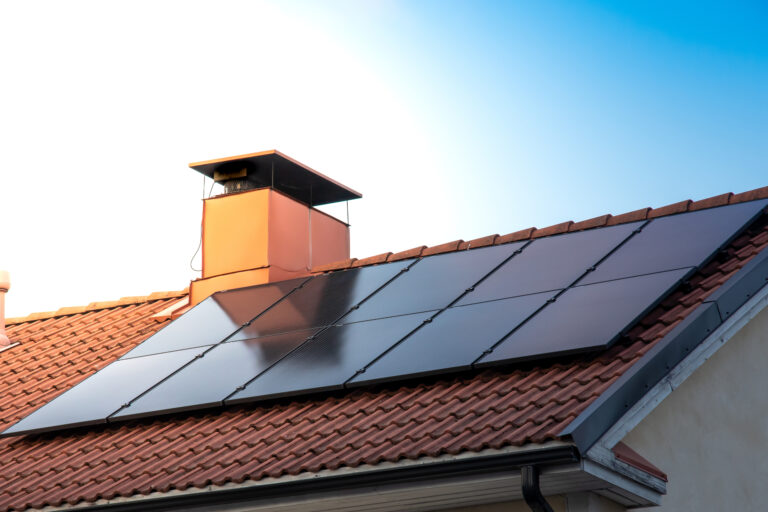 A closeup of solar panels on a roof - renewable energy concept